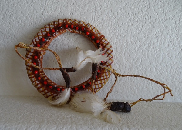 TIWI ARMBAND WITH SEEDS AND FEATHERS